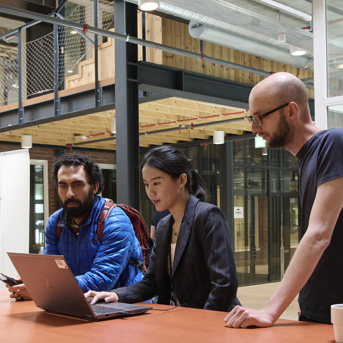 Accelerate with us, employees working on a project