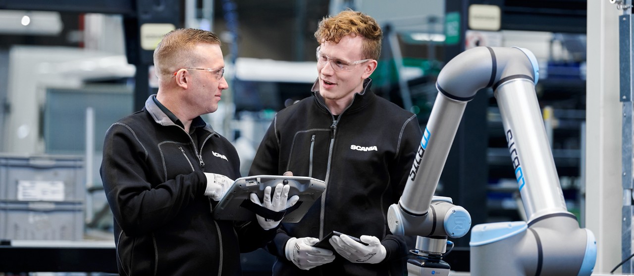 Two people at Scania Cab Assembly